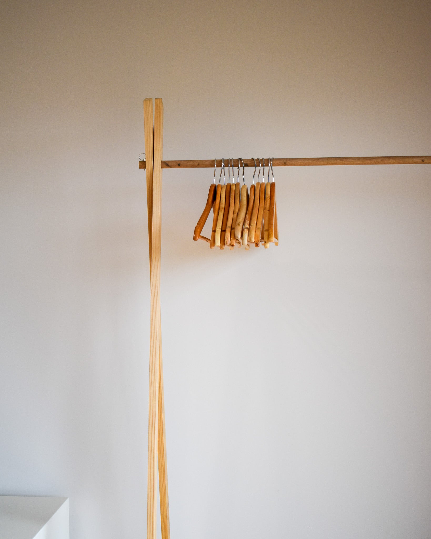 An empty clothing rail waiting for knitwear